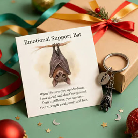Keychain with a bat providing emotional support and a card with a message